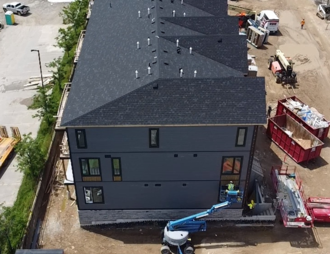 Block D siding underway